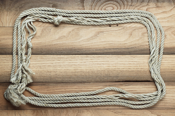 Old wooden background with ship rope - Foto, afbeelding