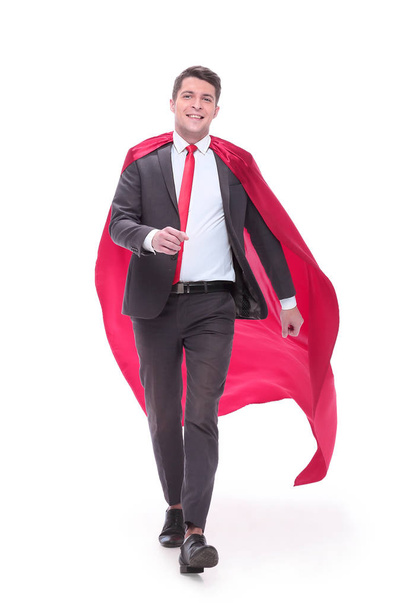 confident businessman in superhero Cape striding forward. - Foto, Imagen