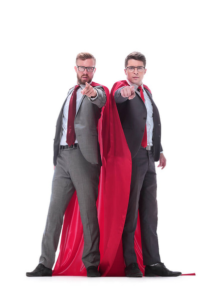 in full growth. two superhero businessman pointing at you - Fotó, kép