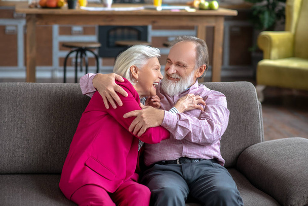 Happy elderly couple having great time at home together - Valokuva, kuva