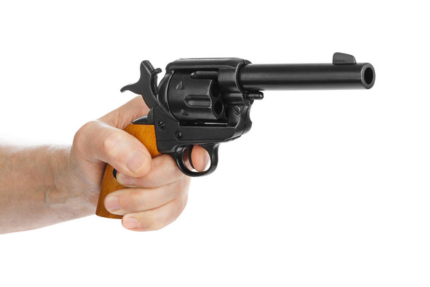 Hand with revolver gun isolated on white background - Photo, image
