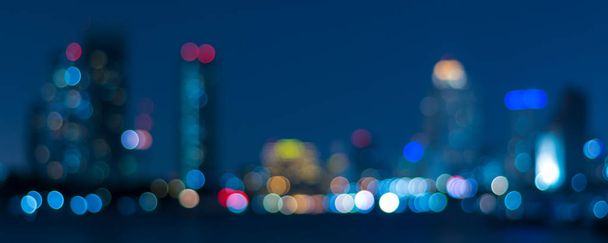 Banner cover of blurred bokeh cityscape at twilight time, city background, aerial view angle from rooftop ob building, defocused city in downtown,graphic design for web online or book horizontal cover - Photo, Image