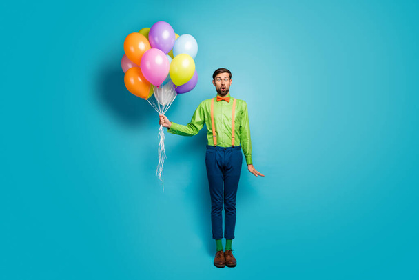 Full length body size view of his he nice attractive funky amazed wondered cheerful guy holding in hands air balls isolated on bright vivid shine vibrant blue green teal turquoise color background - Foto, Bild