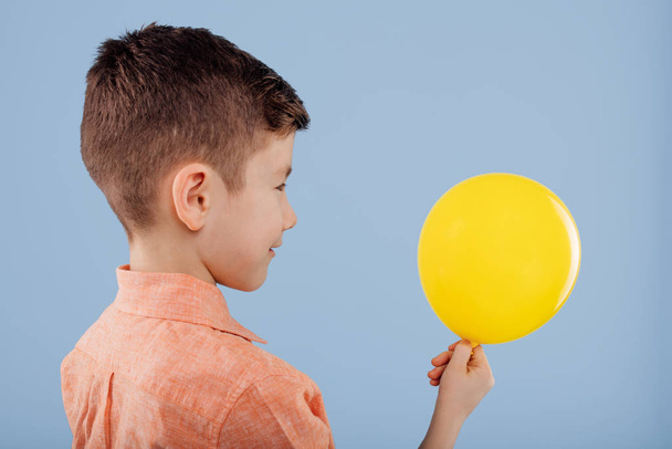 child. little boy holds a yellow balloon.  - Photo, image