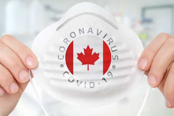 Αναπνευστική μάσκα με σημαία Καναδά - Coronavirus COVID-19 incipal concept - Φωτογραφία, εικόνα