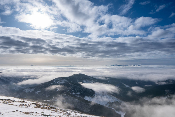 Snow covered mountains with clouds and mist in valley, Low Tatras Dumbier, Slovakia - Fotó, kép