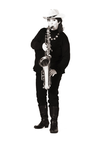 Woman in black playing saxophone. - 写真・画像