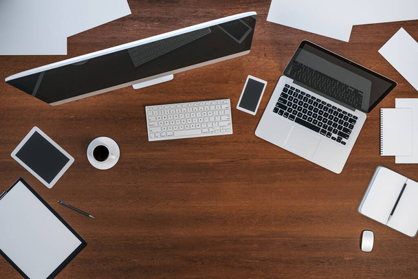 Вид сверху современного дизайнерского рабочего стола с компьютером, ноутбуком и офисной техникой. 3D рендеринг
 - Фото, изображение