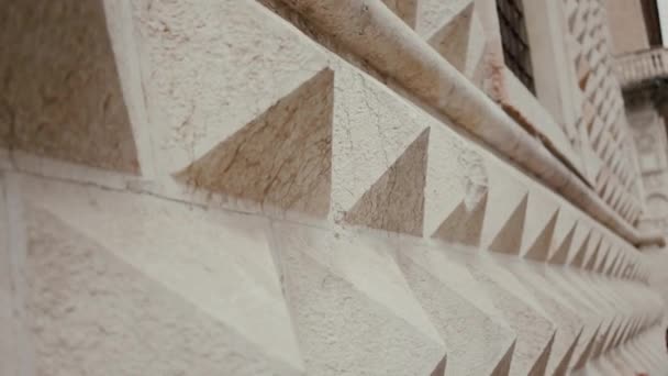 Marble facade of Italian palace in Ferrara, detailed. Girl touches wall blurry - Filmagem, Vídeo