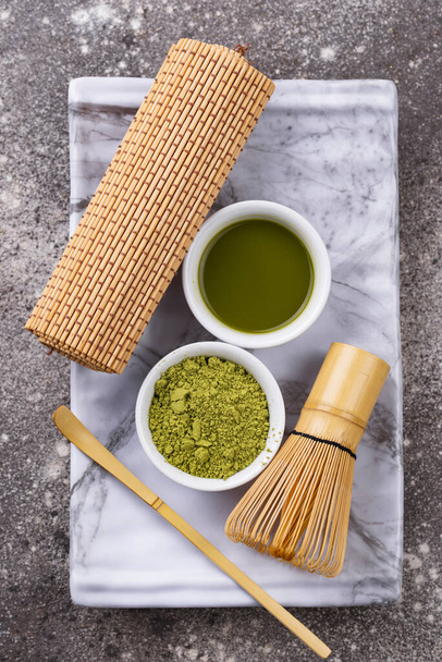Matcha tea and bamboo whisk - 写真・画像