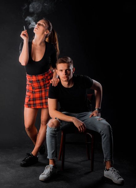 Pair of young male and female models posing in modern clothing - Foto, Bild