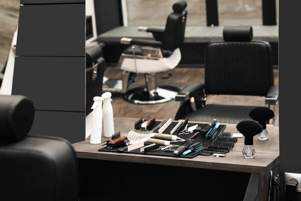 Hairdresser tools on table in barber shop - Photo, Image