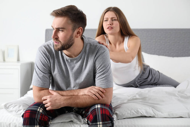 Young couple with relationship problems in bedroom - Photo, Image