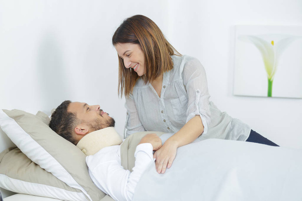 wife caring about her ill husband lying in boyfriend - Фото, изображение