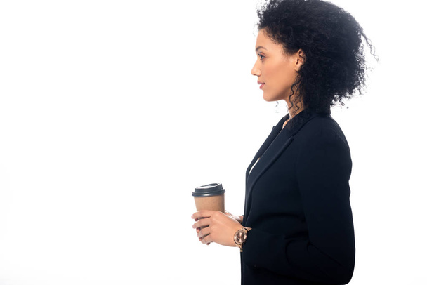 Side view of african american with disposable cup of coffee isolated on white - Photo, image