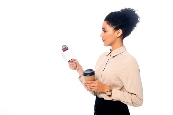 African american journalist with microphone and disposable cup of coffee isolated on white - Fotografie, Obrázek