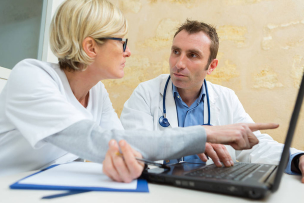 doctor and specialist comparing results online - Photo, Image