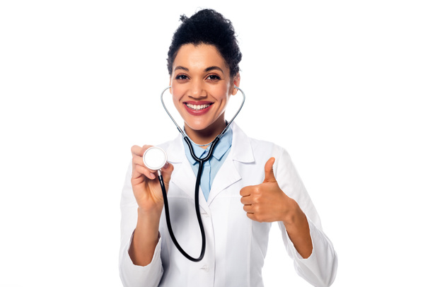 African american doctor with thumb up showing stethoscope and smiling isolated on white - Photo, Image
