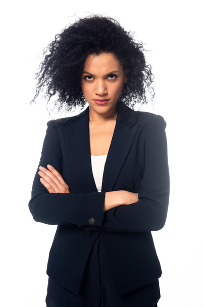 Front view of angry african american businesswoman with crossed arms looking at camera isolated on white - Fotografie, Obrázek