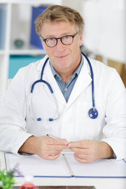senior doctor on white background - Zdjęcie, obraz