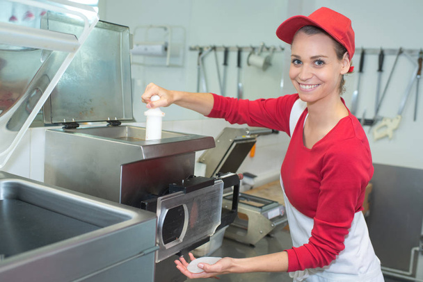 female cook smiling preparing sandwiches - Фото, изображение