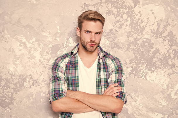 man among men. barbershop concept. mens sensuality. sexy guy casual style. macho man grunge background. male fashion summer trends. confident student checkered shirt. unshaven man care skin and beard - Фото, зображення