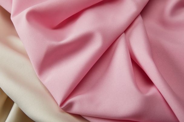 close up view of satin pink and white soft and wavy fabric - Photo, Image