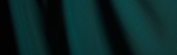 close up view of emerald soft and wavy silk fabric, panoramic shot - Foto, immagini