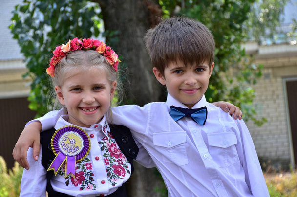  a beautiful girl with a wreath on her head and a boy, - Photo, Image