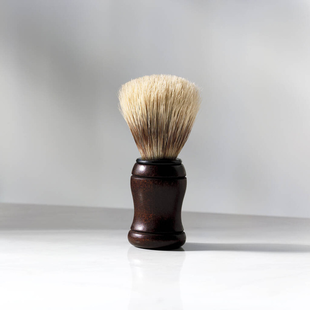Closeup on a shaving brush with shaving  - 写真・画像