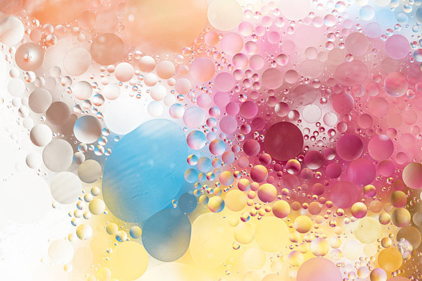 Oil drops in water - a colorful abstract background - 写真・画像