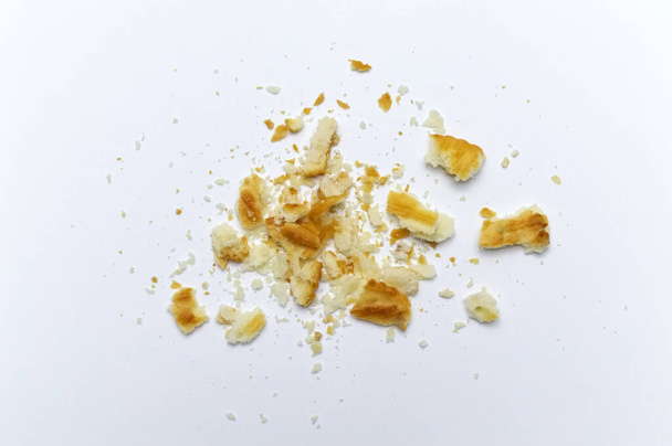 Crumbs of cookies on white background. - Photo, Image