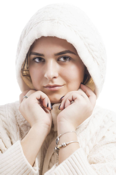 Close up portrait of a young cute woman with white sweater. - Foto, imagen