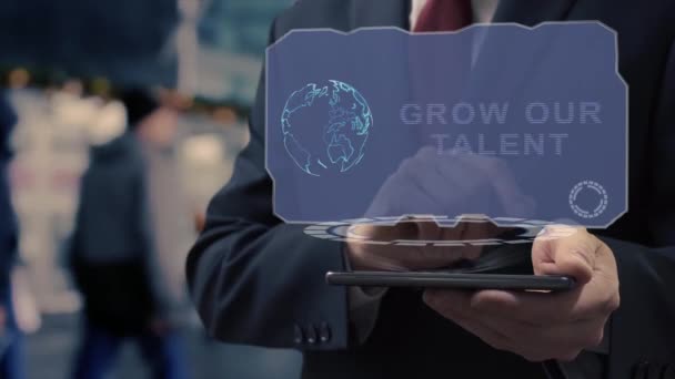 Businessman uses hologram Grow our talent - Footage, Video