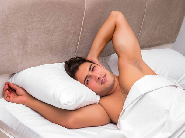 Man having trouble waking up in the morning - Photo, image