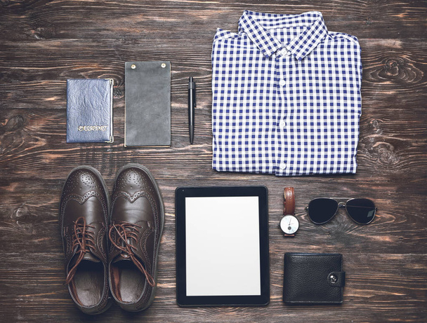 Stylish male clothes with accessories and tablet computer on wooden background - Foto, Imagem