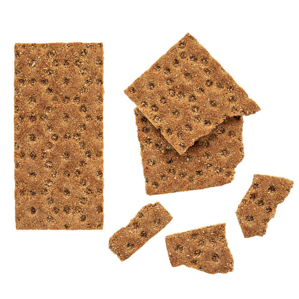 Creative layout made of Rye crispy cracker.  Wholegrain crackers  or flat bread  isolated on white background. Top view - Foto, afbeelding