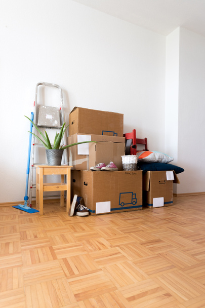 Move. Cardboard boxes, cleaning stuff and things for moving into a new home   - Photo, Image