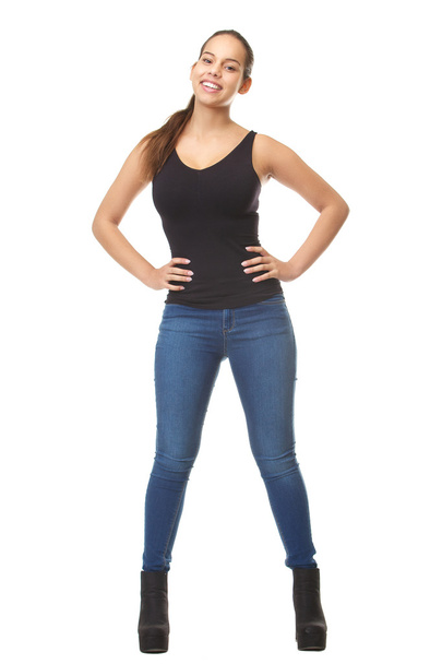 Portrait of a young woman smiling in blue jeans - Foto, imagen
