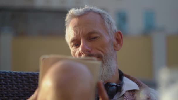 Attractive Mature Man Writes Ideas In A Notebook - Filmati, video