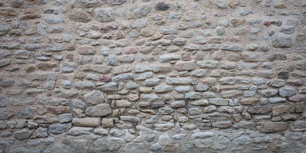 Old stone gray wall made of large small natural stones - Photo, Image