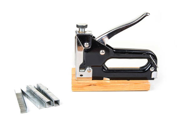 Heavy duty staple gun with staples on the white background - Photo, Image