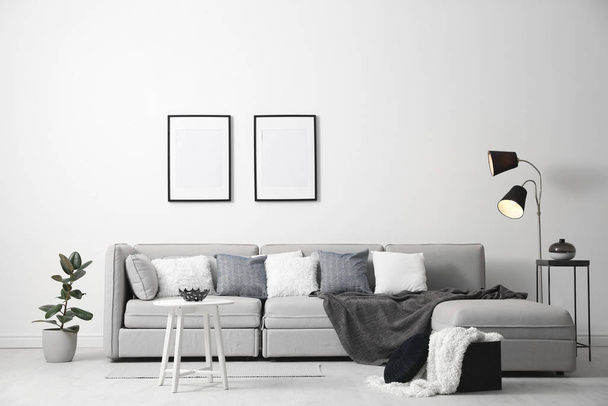 Stylish living room interior with comfortable sofa - Foto, Imagen