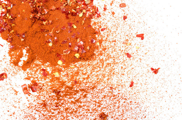 Ground pepper scattered on a white background - Photo, image