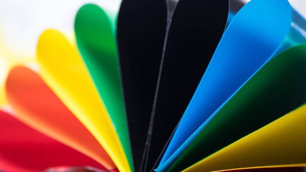 Colorful card stock in unique elliptical shapes with shadow effect and selective focus - Photo, Image