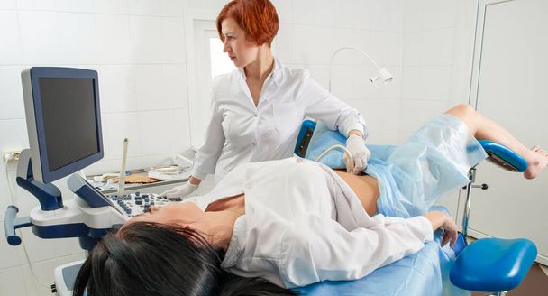 Gynecologist doing ultrasound scanning for pregnant woman - Photo, Image