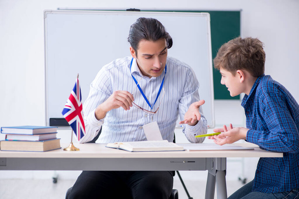 Male english teacher and boy in the classroom - Photo, Image