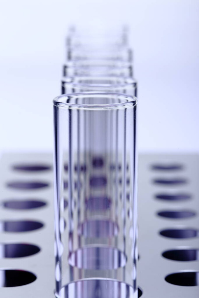Abstract Group of Glass Tube Empty Laboratory on Stainless Steel Stand, studio lighting white background isolated copy space, closeup - Φωτογραφία, εικόνα