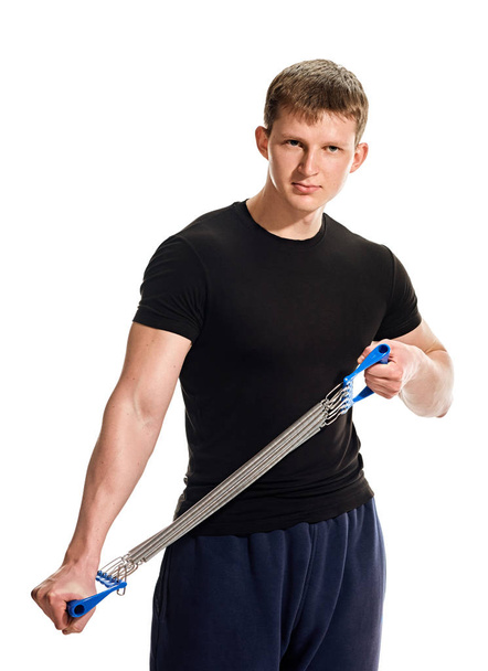Man training with expander - Photo, Image