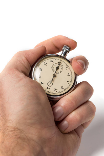 Velho cronômetro para medir o tempo em um fundo branco
 - Foto, Imagem